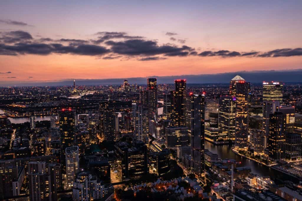 A panoramic aerial view of the East London skyline at night