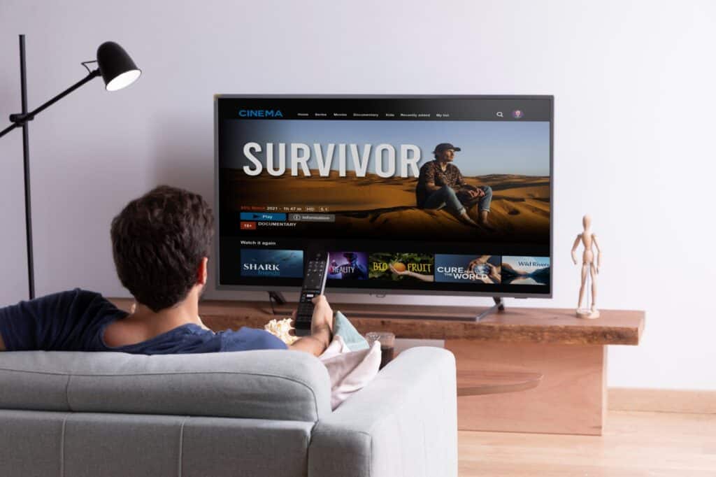 A man watching on the TV after moving in
